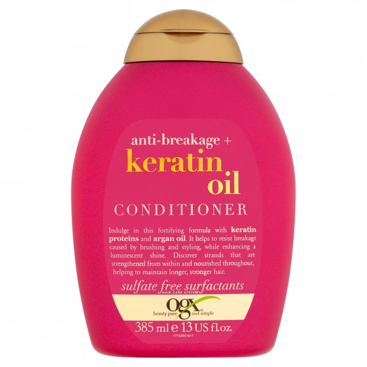 Ogx Anti-Breakage Keratin Oil Conditioner 385ml bottle front view with white and orange label