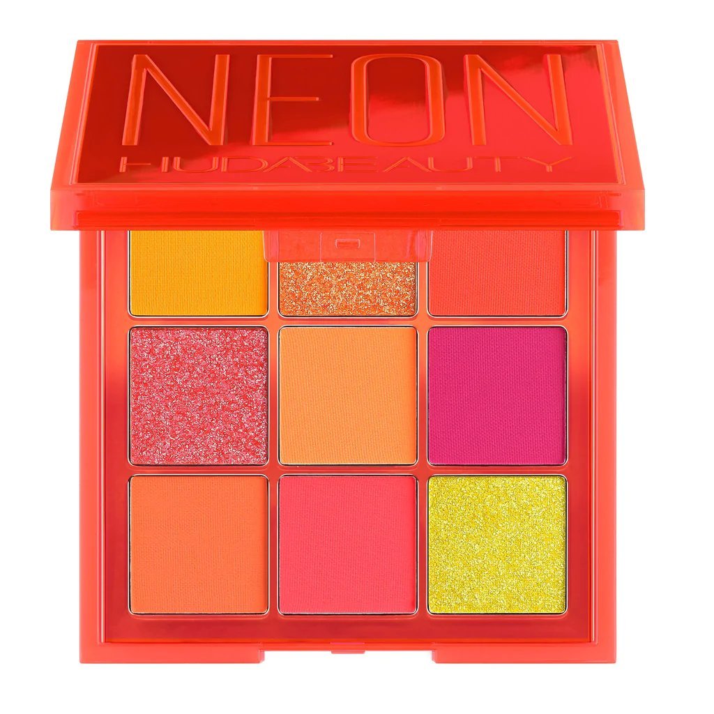 Huda Beauty Neon Orange Obsessions Eyeshadow Palette in sleek black compact with nine vibrant neon-orange shades, swatches on arm