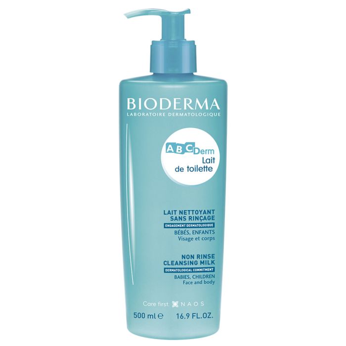 Bioderma ABCDerm Cleansing Milk 500ml bottle with pump, white and teal packaging on light background